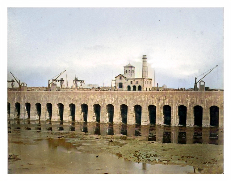 Looking across the dock at the engine house, prior to opening of dock in 1865. Note massive construction of dock walls. 82.24