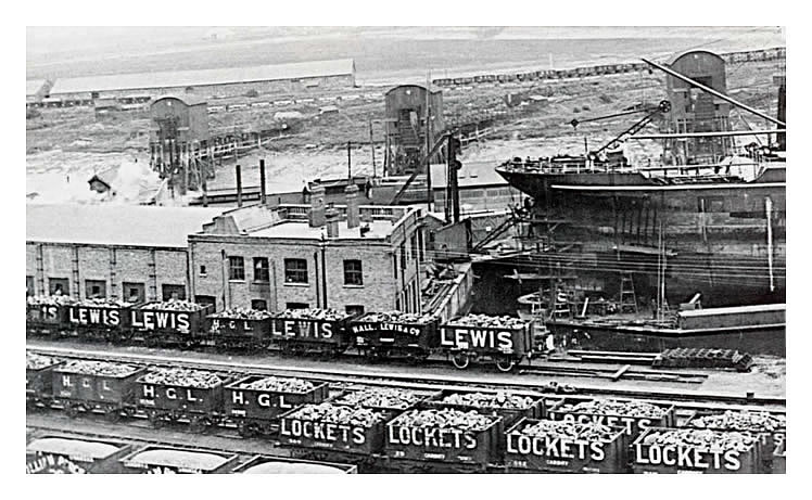 A photograph taken on a warm summer day in July 1923 of the numerous sidings situated at the rear of the main machine shop and offices of the Penarth Pontoon and Ship Repairing Company Limited. 