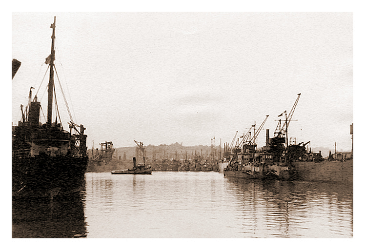 1943-4 - A view up the Penarth Dock showing the LST's and the cargo moorings. 