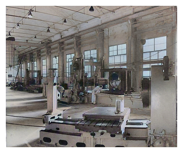 1970s - 80s - A photograph of the main machine shop with a large bearing housing on the large planer bed.