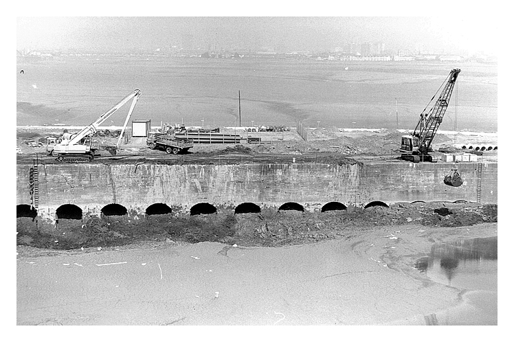 21st April 1987 - Construction of the Penarth Marina - Another photographic view taken from the high ground on the southern side of the basin illustrating the extent of the debris and silt within the basin.