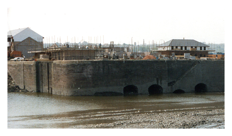 April 1987 - Construction of the Penarth Marina - A photograph of the Basin looking towards the north-east arched wall and the entrance to the lock between the basin and main dock.