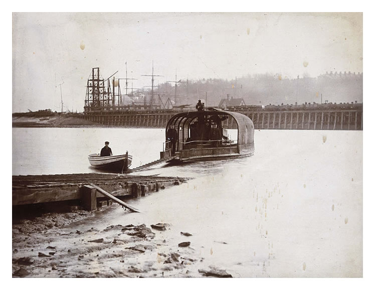 1899 - A photograph of the old chain ferry with the timber shorings supporting the river embankment.
