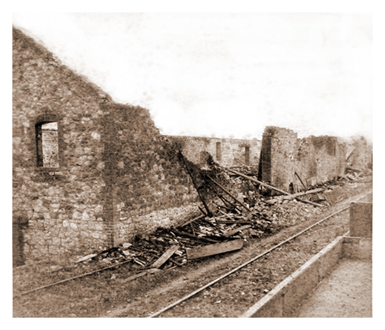 1888 - After the fire - The exterior of 'T' Warehouse at Victoria Wharf, Ely Tidal Harbour, Penarth Dock. 