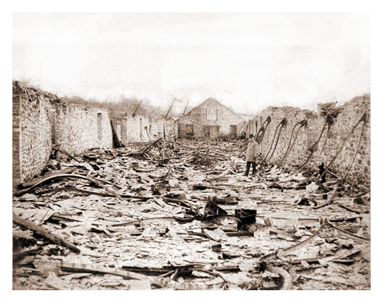 1888 - After the fire - The exterior of 'T' Warehouse at Victoria Wharf, Ely Tidal Harbour, Penarth Dock. 