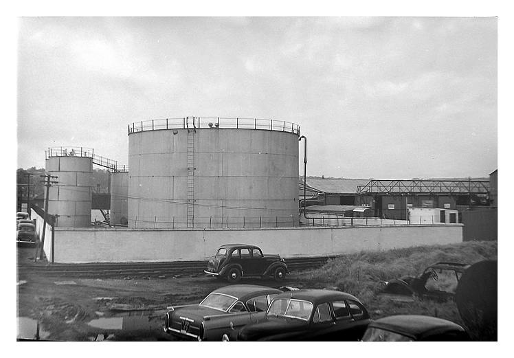 mid-1950's to early 1960's - A photograph of the oil storage tanks situated at the Ferry Road side of the River Ely Tidal Harbour.