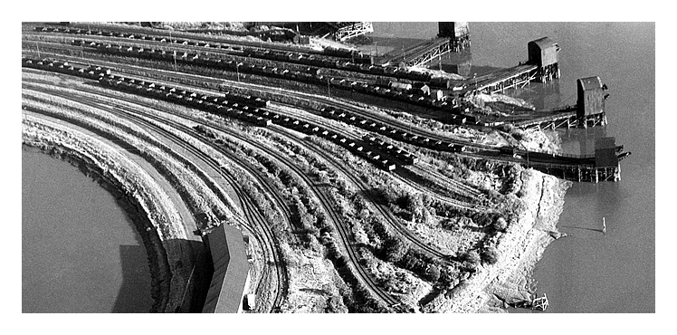 1955 - An aerial view of the meandering River Ely with the Victoria Wharf of the South Wales Warehouses Limited with associated warehouse and rail facilities.