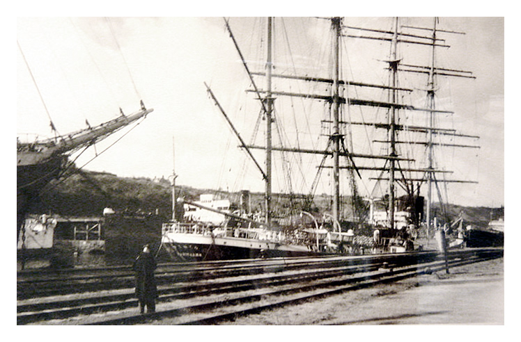 1950 - 'Pamir', with bowsprit of 'Passat' visible, moored at Penarth Dock.