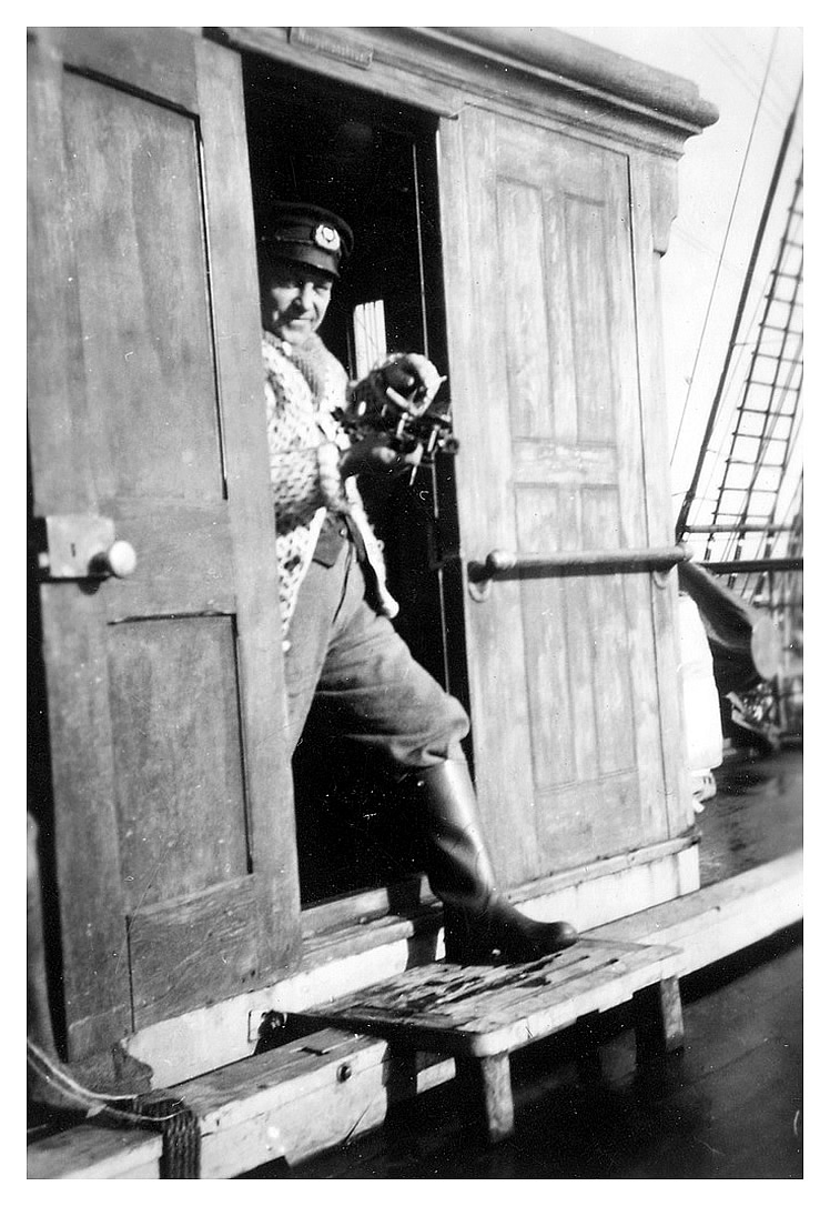 Captain Ivar Hagerstrand 'taking the sun' (taking a sextant reading) on board the 'Passat'.