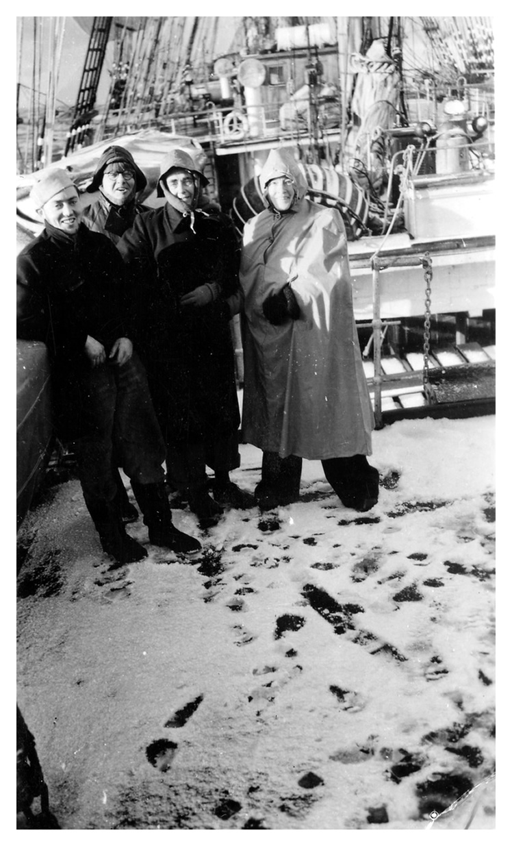 1948 - Passengers standing on the snow-covered deck of the 'Passat' on 'Cape Horn Day', 3 July 1948.