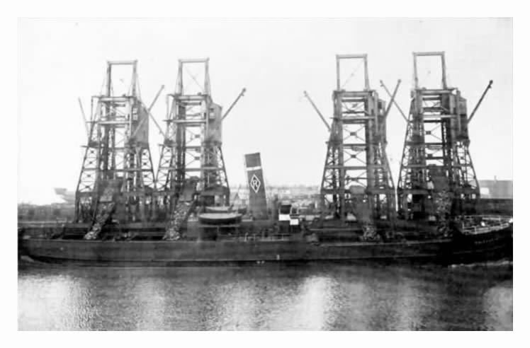 R. & J. H. Rea steamship being loaded in all four holds similtaneously at tips 15, 16, 17 & 18 being the 'record breakers' for loading of coals at Penarth Dock