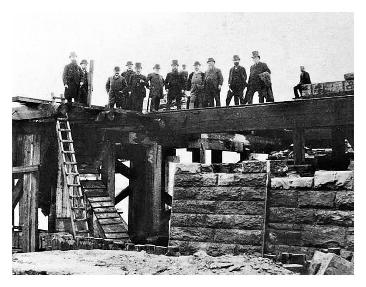 1866 - A posed photograph of gentlemen viewing the progress of the works at the River Taff Swing Bridge and approaches.