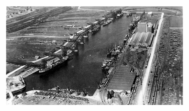 Barry Dock - Coal tips in No. 2 dock with the Atlantic Mill of of J. H. Rank & Company.