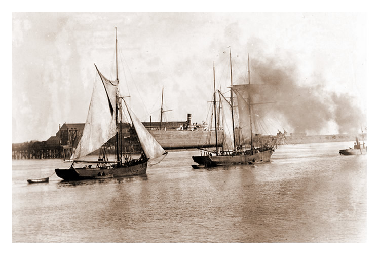 Vessels in the Cardiff docks channel to the sea.