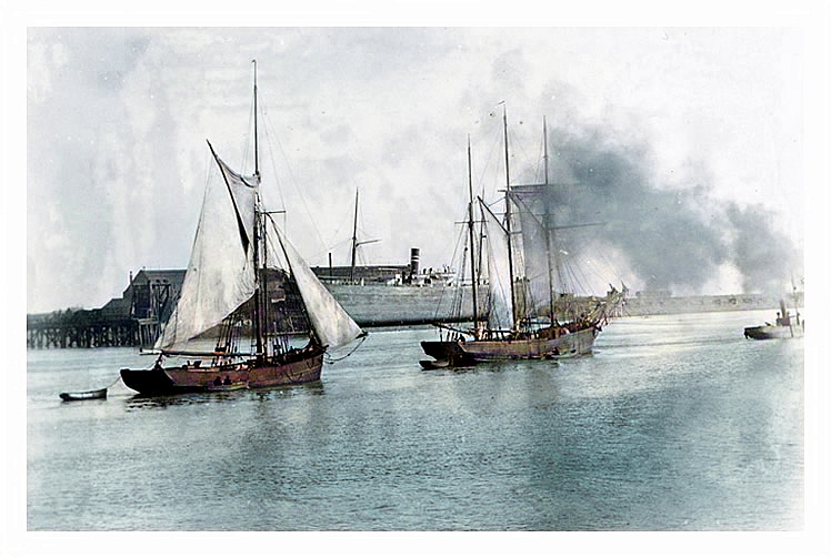 Vessels in the Cardiff docks channel to the sea.