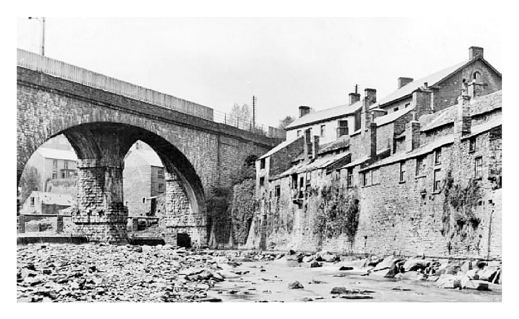 The bridge as described in the article is the skewed viaduct spanning the River Rhondda at Newbridge to a design of Mr. I. K. Brunel.