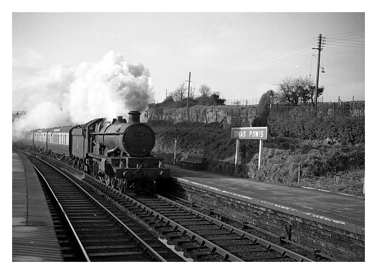 1953 - British Railways locomotive 5082 and passenger train passing through Dinas Powis station on the up line during June 1953.