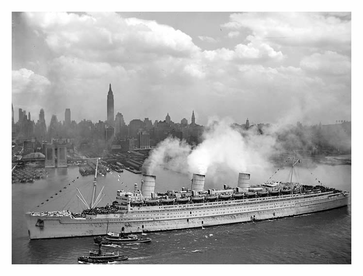 The R.M.S. Queen Mary sailing into New York harbour on the 20th June 1945 with 12,000 returning troops.