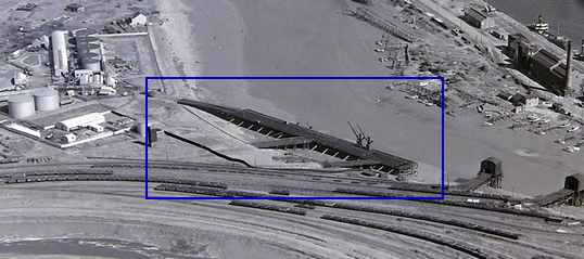 A section of an 1949-50 ariel photograph showing part of the River Ely Tidal Harbour with the location of the ballast/iron ore/oil wharf on the Ferry Road side of the river.