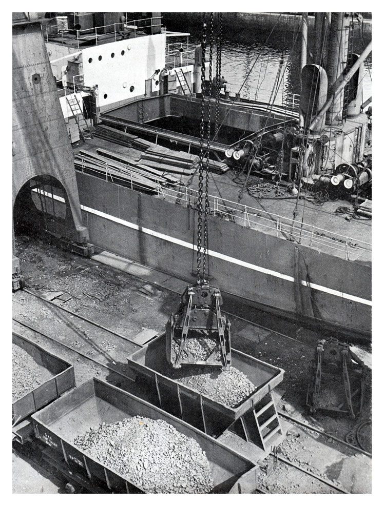 Unloading iron ore at Roath Dock, Cardiff, destined for Guest, Keen, Baldwins iron and steel works nearby.