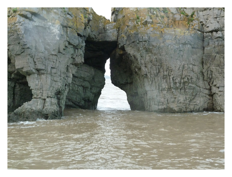 Arrival at Flat Holm -&nbsp;The view through the rock formation known as Castle Rock.